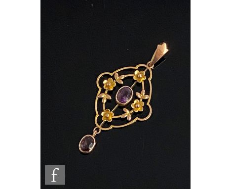 An Edwardian 9ct two stone amethyst open work pendant terminating in collar set oval stone drop. weight 1.5g, length 4cm, sta