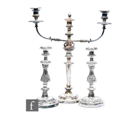 A pair of 19th Century silver plated candlesticks, circular bases with foliate decoration below knop columns and circular sco