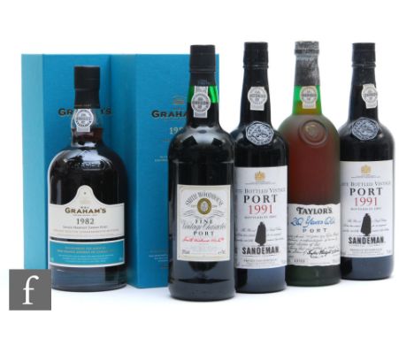A collection of vintage ports, to include two boxed bottles of Graham's 1982 Tawny port, a limited bottling to celebrate the 