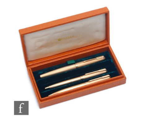 A cased set of three 9ct hallmarked Parker writing implements, a fountain pen, a biro and a pencil, each with engine turned d