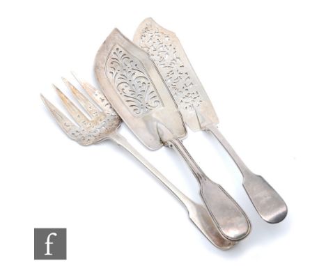 A Victorian hallmarked silver fiddle pattern fish slice and fork each with pierced blades, with a&nbsp; fiddle and thread fis