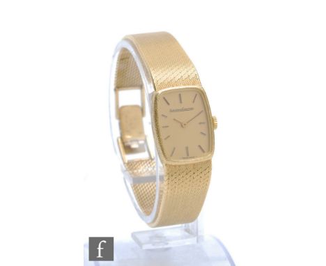 A lady's 18ct Jaeger Le Coultre manual wind wristwatch, gilt batons to a cushioned rectangular champagne dial and integral 18