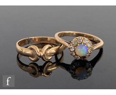 An 9ct opal and diamond daisy cluster ring, central opal within a diamond surround, one stone missing, with a 9ct gold ring, 