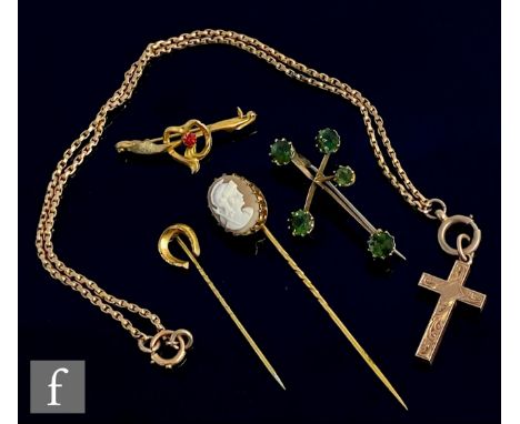 A small parcel lot of 9ct jewellery to include a cross and chain, two brooches and two stick pins, total weight 14.5g, variou