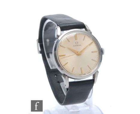 A mid 20th Century gentleman's Omega stainless steel manual wristwatch, gilt batons to a cream silvered dial, case diameter, 