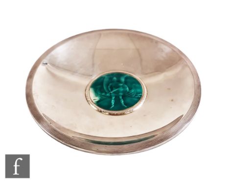 A Scandinavian silver circular shallow dish with central green enamel scene of a Viking stood in front of a longboat to well,