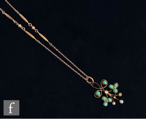 An early 20th Century seed pearl and turquoise set open work pendant suspended from a fine fancy link trace chain, total weig