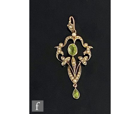 An early 20th Century 9ct peridot and seed pearl set open work pendant, weight 3g, length 5cm. 