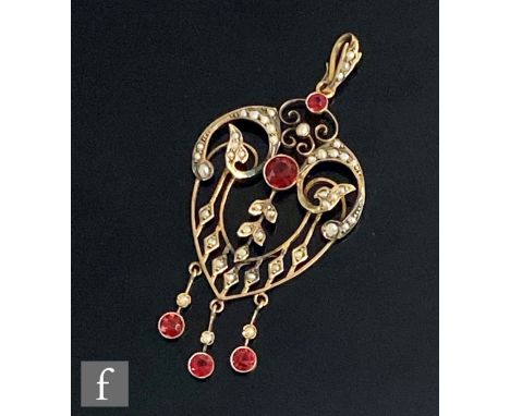 An Edwardian 9ct red paste stone and seed pearl open work pendant, weight 4.7g, length 6.5cm, stamped 9ct to reverse. 