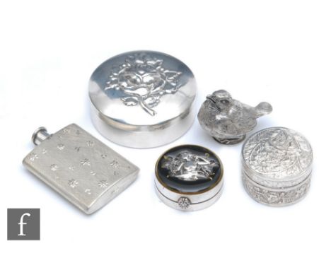 A small French white metal menu or place card holder formed as a bird, together with a silver ring box of circular form with 