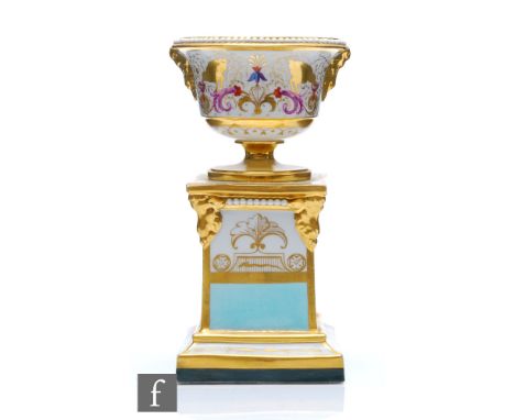 A 19th Century Barr, Flight and Barr vase affixed to a pedestal base decorated with gilt birds with their beaks in bowls and 