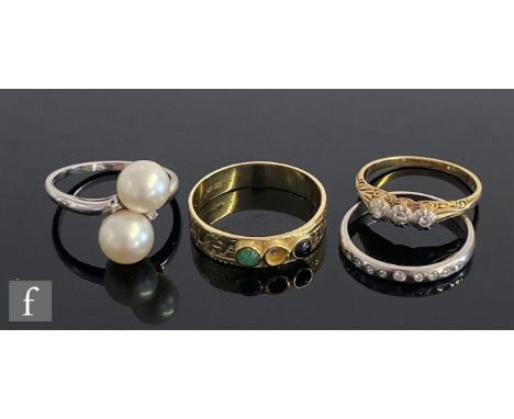 Three 14ct stone set rings to include a two stone pearl, a diamond three stone and a multi stone ring, total weight 9.5g and 