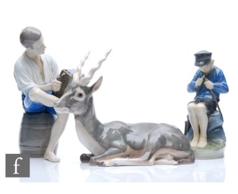A Royal Copenhagen model of a Whittler Boy, shape 905, modelled by Christian Thomsen, printed mark, height 19cm, together wit