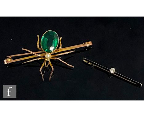 A 9ct bar brooch modelled as a spider with green stone and pearl body, weight 9g, length 6.5cm, with a single stone diamond s