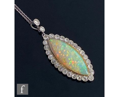 An 18ct white gold opal and diamond pendant, collar set central marquise opal, length 3cm, within a border of twenty six old 