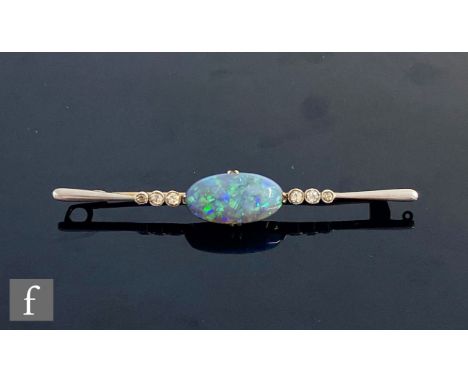 An early 20th Century black opal and diamond bar brooch, central claw set oval opal, length 18mm, weight 4.4, length 6.5cm, f