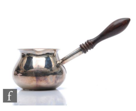 A modern hallmarked silver brandy warmer, plain bowl terminating in turned wooden handle, length 15cm, Birmingham 1976,&nbsp;