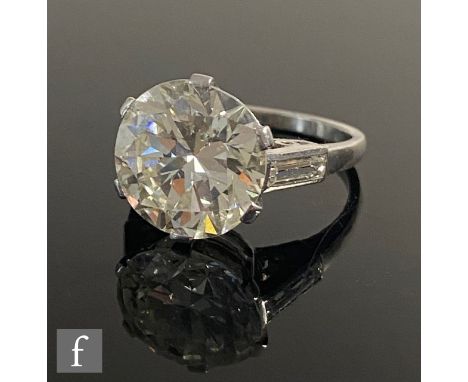 An early 20th Century platinum diamond solitaire ring, brilliant cut set stone, weight 5.65ct, colour K, clarity SI2, to a si