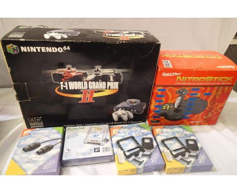 Nintendo 64 boxed console with one green controller, power pack and AV connection (lacking GP2 game) with several boxed acces