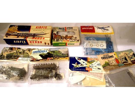 Selection of seven Airfix kits/figures including two Spitfire, Sherman and Churchill tanks, D.H. Heron, farm animals etc, all