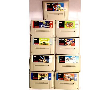 Nine Super Nintendo game cartridges; Mario Paint, Mario All Stars, Return Of The Jedi, R-Type III, F Zero, Rock n Roll Racing