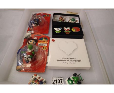 Nintendo Super Mario blister packed mini figures boxed enamelled pin badges and the Nintendo Sound Selection on CD. P&amp;P G