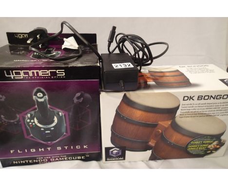 Nintendo GameCube peripherals including a power pack, boxed, Donkey Kong bongos and flight stick. P&amp;P Group 3 (£25+VAT fo