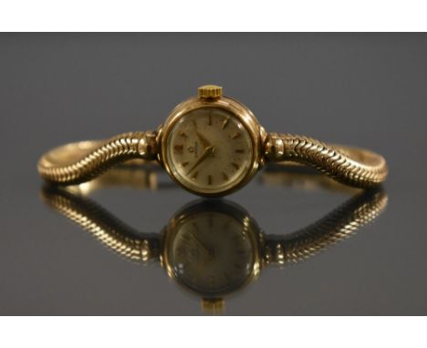 Omega - a lady's 9ct gold bracelet watch, silvered dial, pear batons, arrow hands, manual wind 244 cal movement, serial No 13