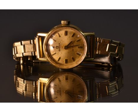 Omega -  a lady's De Ville 18ct gold cased wristwatch, gilt dial, block batons, faceted crystal, manual wind 620 Cal movement