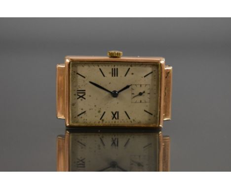 A Gentleman's vintage Trebex 9ct gold cased wristwatch head, rectangular silvered dial, Roman numerals, minute track, subsidi