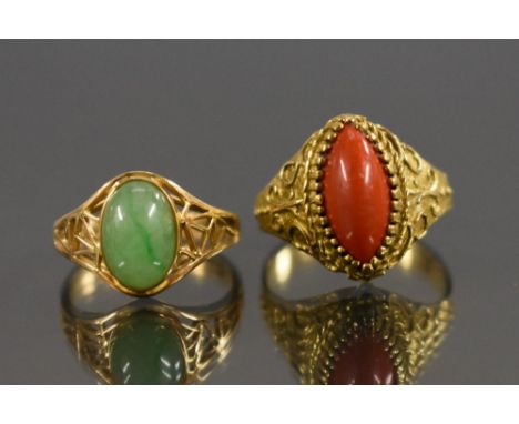 Rings - a Chinese 18ct gold and green stained jade cabochon ring, stamped 18k 750, size L; another Uno A R coral and 18ct gol