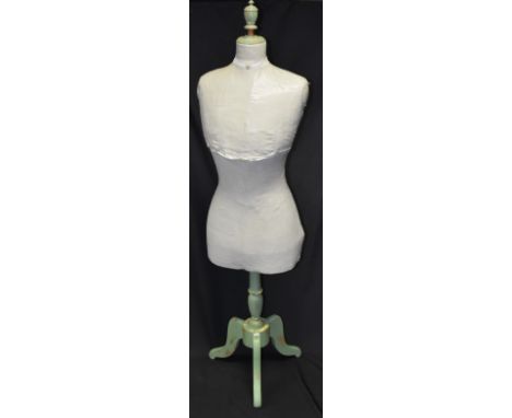 A Stockman female mannequin circa 1910, tripod stand, urn shaped finial, overpainted body