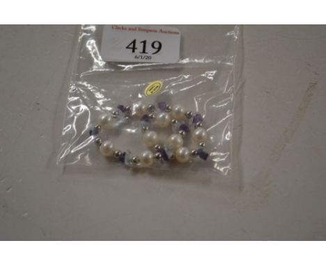 A simulated pearl and amethyst bracelet 