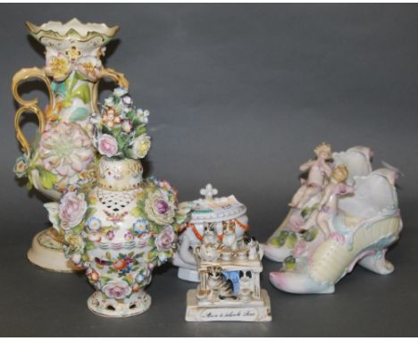 A late 19th century continental porcelain oval lidded trinket box, modelled as a hand holding a casket, 10 cm high (finial re