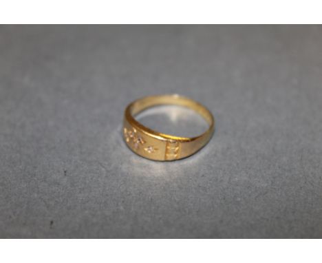 A Victorian 18ct gold ring, the face gypsy set with diamond chips, ring size O