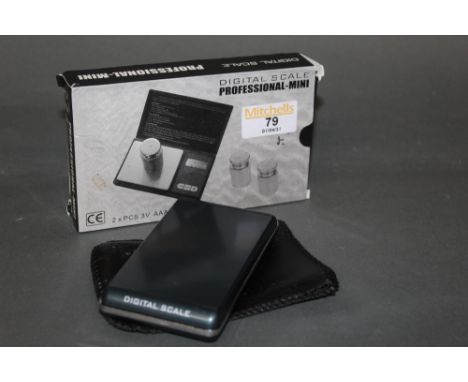 Two digital scales, one boxed and one with vinyl sleeve.