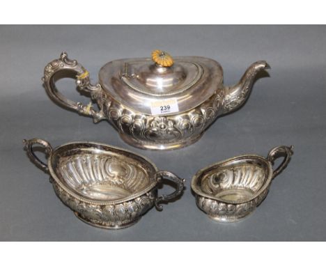 A Victorian silver plated three piece tea service, with squat gadrooned bodies, comprising teapot, two handled sugar basin an