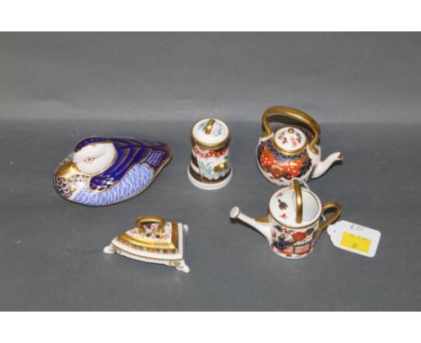 A Royal Crown Derby Imari paperweight with gold stopper, in the form of a duck, and four miniature Royal Crown Derby Imari pa