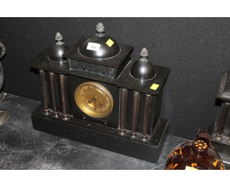 A 19th century black slate mantel clock of architectural design, the gilt dial with Arabic numerals to the two train movement