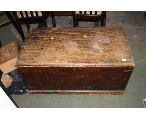 A 19th century stained pine rectangular trunk, 98 cm wide (with damage) containing a small selection of books