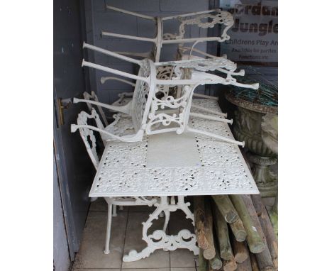 A white painted cast metal garden set by Forecast Furniture Limited of Victorian design, comprising rectangular table, 153 x 