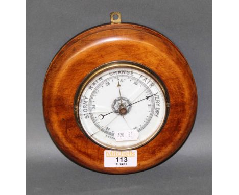 A Victorian stained beech cased aneroid barometer, 16 cm diameter (cracked to glass) 