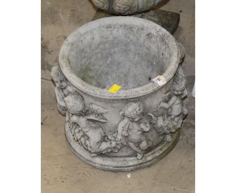 A cast composite stone circular garden planter, moulded in relief with garlands and putti, 24 cm x 26 cm 