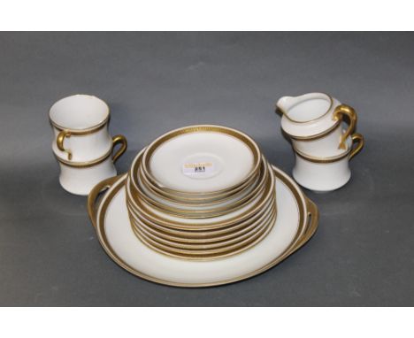 A Frank Haviland Limoges porcelain part tea service, retailed by H G Stephenson of Manchester, decorated in gilt with Vitruvi