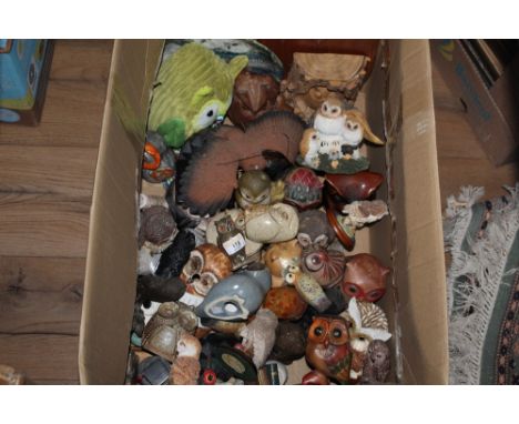 A brass owl, surmount or finial for an ink stand or box, 8 cm high and a very large collection of owl ornaments in resin cera