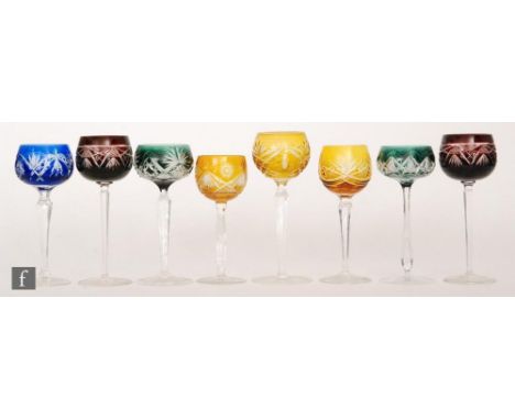 A group of 20th Century cased hock glasses comprising a pair with ruby over clear bowls decorated with cut fan motifs, three 