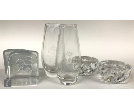 A small collection of Orrefors glass comprising a pair of bookends each with intaglio lions, a pair of candlesticks of wrythe
