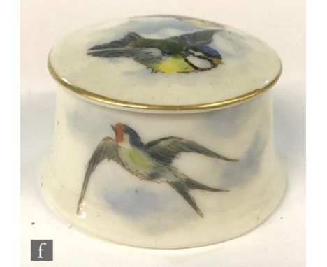 A small Royal Worcester trinket or pill box decorated to the cover with two transfer decorated and hand tinted blue tits in f