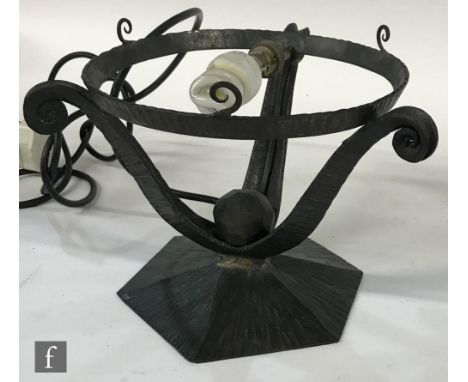 A 1920s French Art Deco wrought iron table lamp base of hexagonal form with three scroll arms supporting a ring, lacking shad