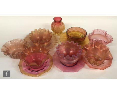 A collection of seven 19th Century finger bowls in shades of ruby, amber and pink, five with a conforming underplate, most wi